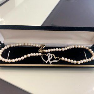 Two Golden Hearts with Diamonds Pendant on a Pearl Necklace!